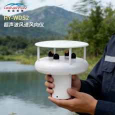 person using crane to move industrial gear box in engineering factory