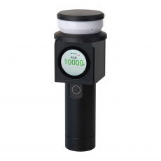 person using crane to move industrial gear box in engineering factory