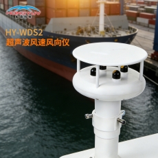 person using crane to move industrial gear box in engineering factory