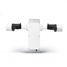 person using crane to move industrial gear box in engineering factory