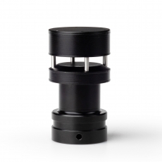 person using crane to move industrial gear box in engineering factory