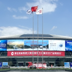 person using crane to move industrial gear box in engineering factory