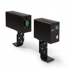 person using crane to move industrial gear box in engineering factory